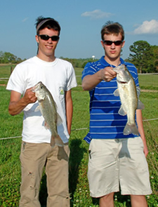 Boys displaying their fish