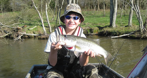 Boy holding a Large Mouth Bass