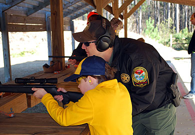 Youth shooting rifle