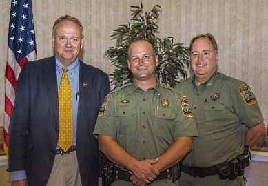 S.C. Department of Natural Resources Conservation Officer John 'J.P.' Jones (center) was presented with the agency's top honors by SCDNR Director Alvin Taylor (left) and Law Enforcement Division Deputy Director Col. Chisolm Frampton (right) at an awards ceremony helld October 5th in Columbia. [SCDNR photo by Taylor Main]