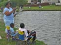 Participants Fishing in Pond