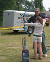 Participant getting instruction in Archery