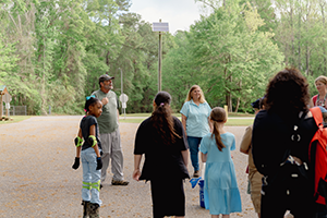 Teacher standing with students