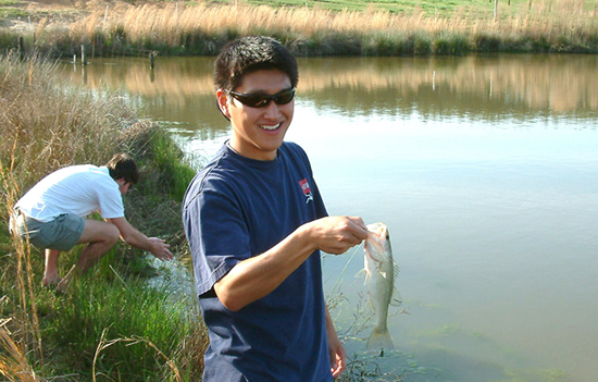 Boy displaying fish