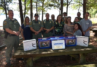 The family of the late Mitchell Don Gibson, a commercial fisherman who was lost on Lake Russell in March 2016, displays the three Lowrance digital side-scanning imaging units that were donated to South Carolina Department of Natural Resources (SCDNR) Region One Law Enforcement to help officers search for drowning victims. The family of the late Mitchell Don Gibson, a commercial fisherman who was lost on Lake Russell in March 2016, displays the three Lowrance digital side-scanning imaging units that were donated to South Carolina Department of Natural Resources (SCDNR) Region One Law Enforcement to help officers search for drowning victims.