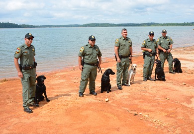 The SCDNR Canine Team, shown here beside Lake Hartwell in Pickens County, will be a key ingredient in SCDNR's law enforcement efforts. From left are Lance Cpl. Brian Welch of Clemson and 'Max'; Pfc. Patrick Nettles of Bamberg and 'Cash'; Capt. Gentry Thames of Pineland and The SCDNR Canine Team, shown here beside Lake Hartwell in Pickens County, will be a key ingredient in SCDNR's law enforcement efforts. From left are Lance Cpl. Brian Welch of Clemson and 'Max'; Pfc. Patrick Nettles of Bamberg and 'Cash'; Capt. Gentry Thames of Pineland and 'Rio'; Pfc. Brian Urquhart of Florence and 'Lola'; and Sgt. Freddie Earhart of Moncks Corner and 'Blue.' (SCDNR photo by Greg Lucas)