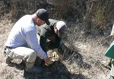 A coyote workshop instructor offers advice to a participant during the first year of the program.