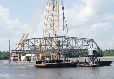 The bridge section is lowered onto a waiting barge. (Photo: Cameron Rhodes) The bridge section is lowered onto a waiting barge. (Photo: Cameron Rhodes)