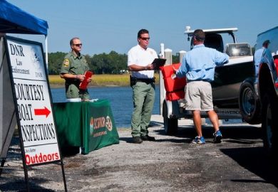 boating inspection stand with people nearby