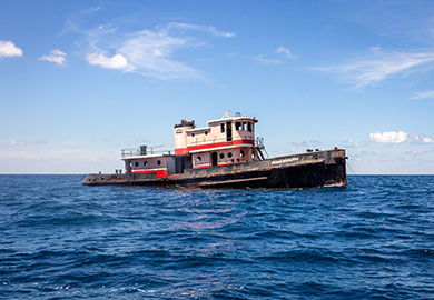 Vessels destined to become artificial reefs are meticulously cleaned before being sunk. (Photo: Emma Berry/SCDNR) The tugboat Susan Richards begins to sink on June 28, 2019. (Photo: Emma Berry/SCDNR)