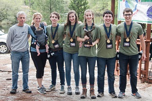 2019 SC Envirothon 1st place team, Team A from Spartanburg High School. From left to right is Coach Rob Wilder, Coach Rebecca Gentry (holding Mark Gentry), Nolan Sykes, Emma Sandego, Isabella Goodchild-Michelman, Nathan Jones, and Justin Barron.