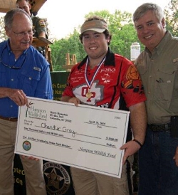 Chandler Gray receives a $1000 scholarship check from the Hampton Wildlife Board.