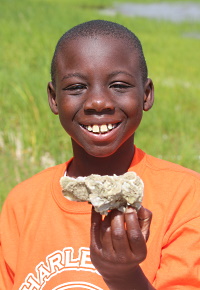 Boy holding a marine sponge