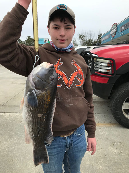 Photograph of Record Tautog with angler M. Terrell