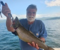 a man holding brown trout
