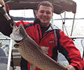 Benjamin Hart and 7 lbs .02 oz Brown trout caught January 19, 2014, Lake Jocassee
