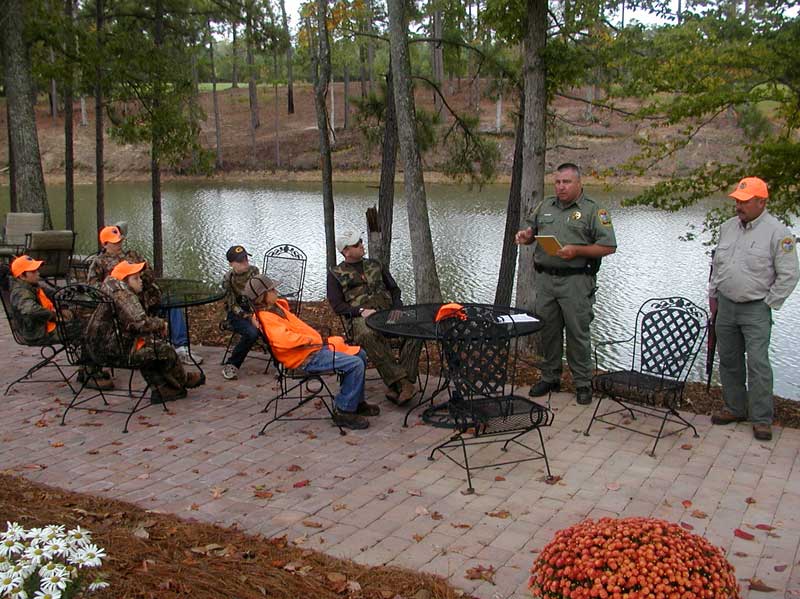DNR Law Enforcement providing training and education at a youth deer hunt.