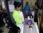 RFS biologist, Michelle Willis, uses a Big Fin Scientific electronic fish measuring board to collect individual total, fork, and standard lengths for each priority fish selected for life history sample collection.