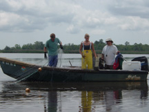 Image of field crew fishing with drift gill net