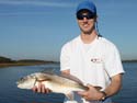 Bryan Apperson with a tagged red drum.