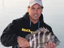Former tagging program director Robert Wiggers with a healthy sheepshead.