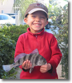 Boy holding a Black Drum Boy holding a Black Drum