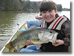 Boy holding a Large Mouth Bass